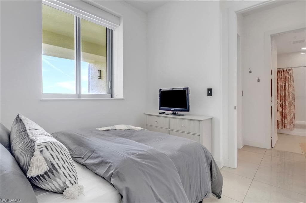 Bedroom featuring light tile patterned floors