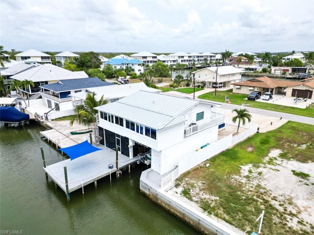 Aerial view of residential area with a nearby body of water