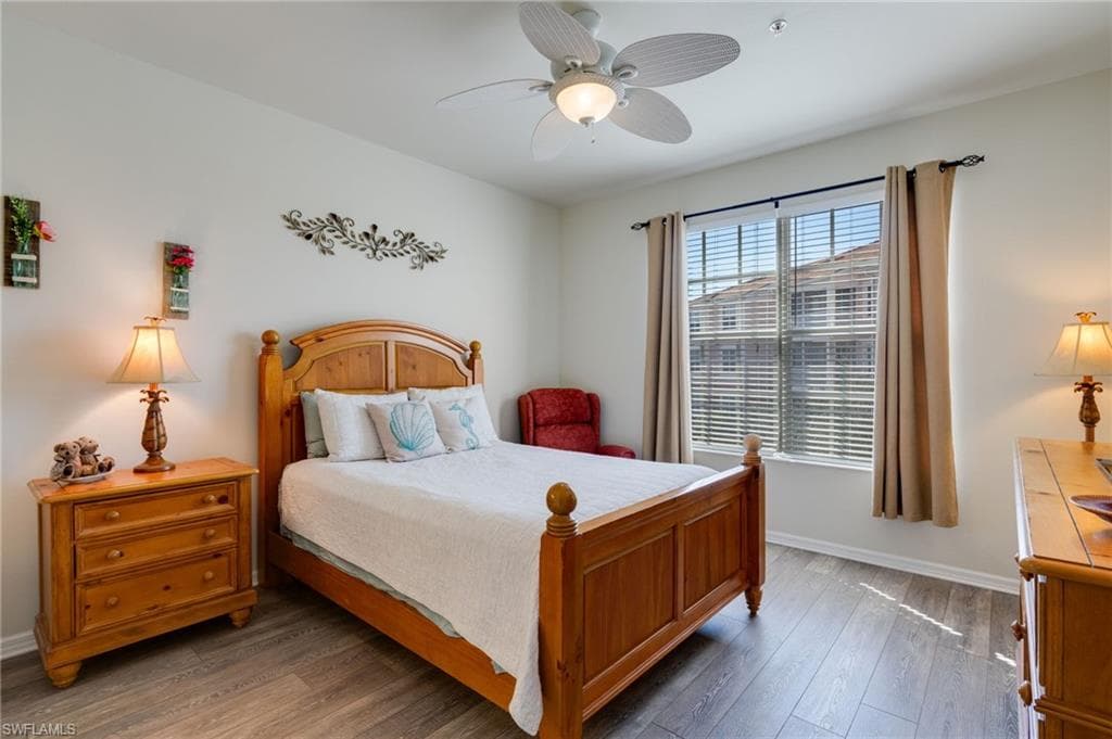Bedroom with wood-type flooring and ceiling fan