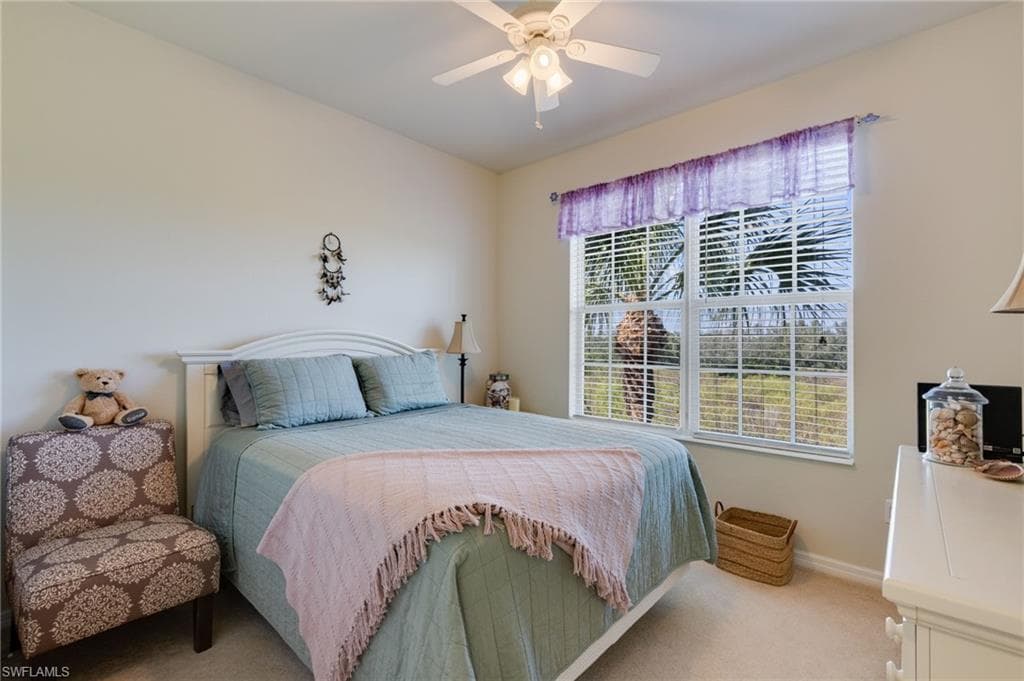 Bedroom featuring carpet and a ceiling fan