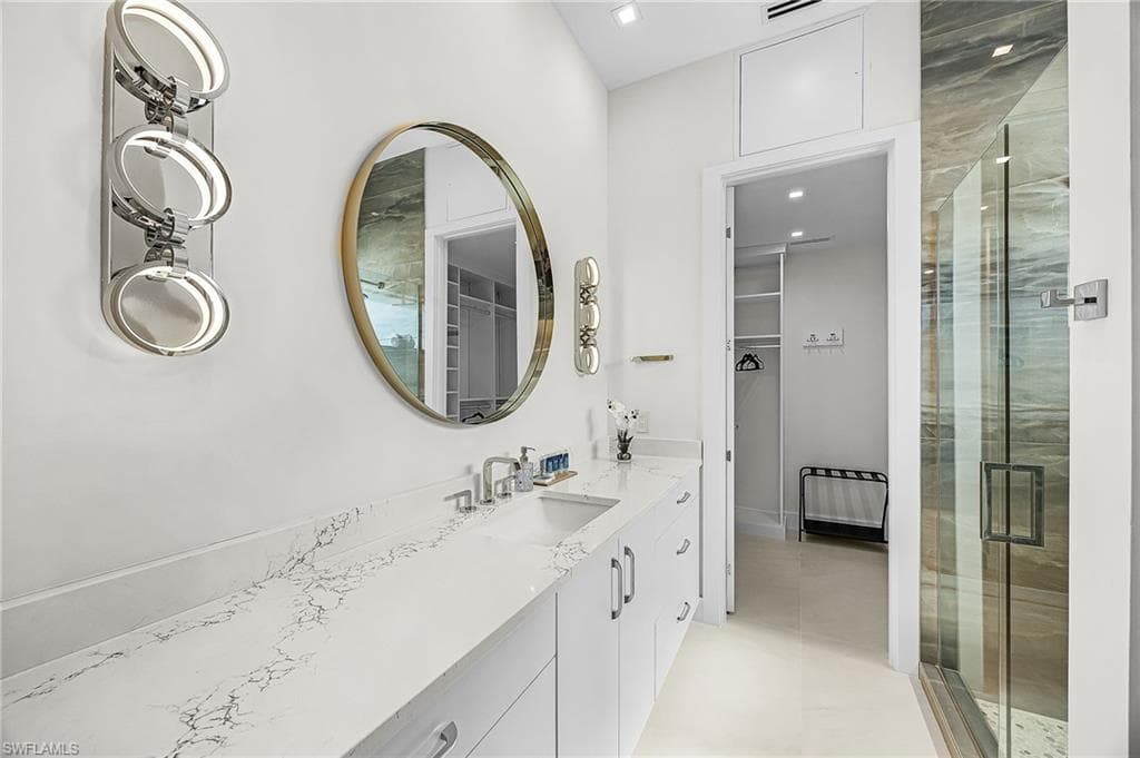 Full bath with a spacious closet, vanity, and a stall shower - Virtually Edited Image