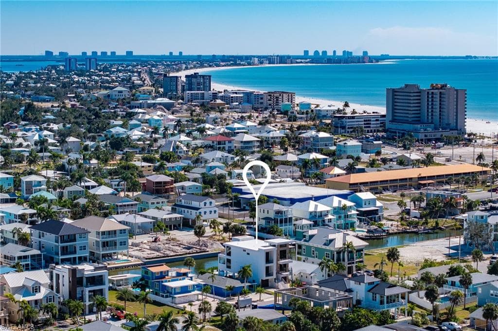 Drone / aerial view of city skyline and a large body of water - Virtually Edited Image