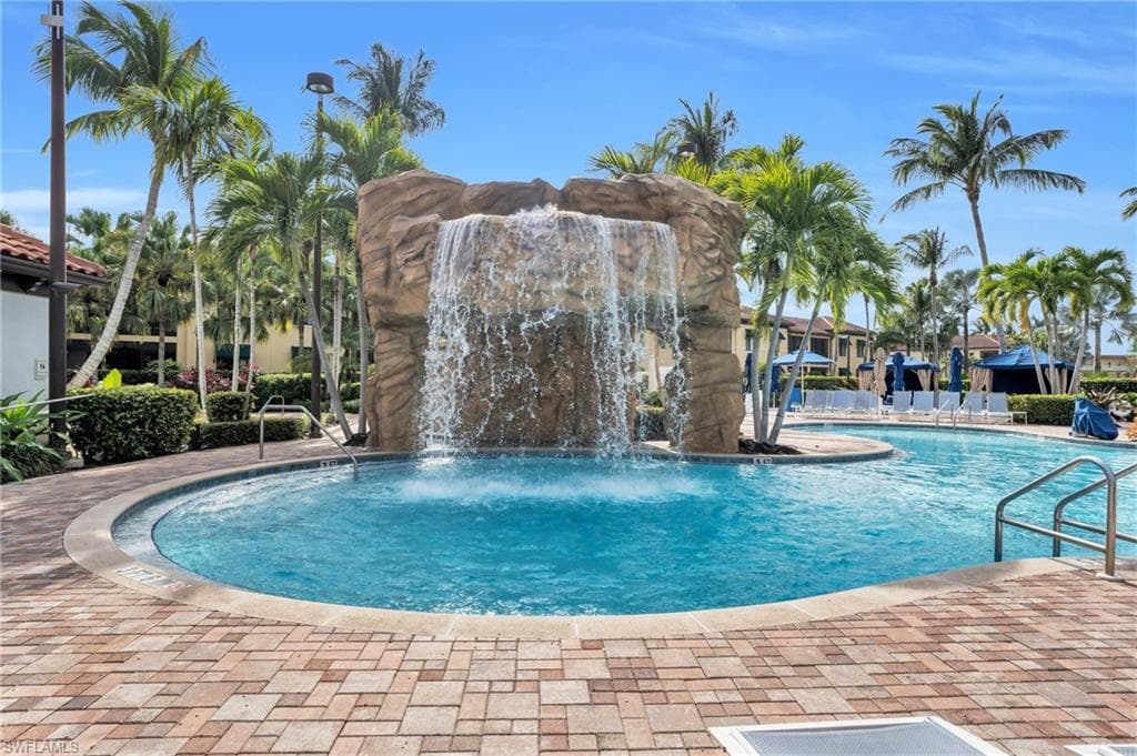 Community pool featuring a patio
