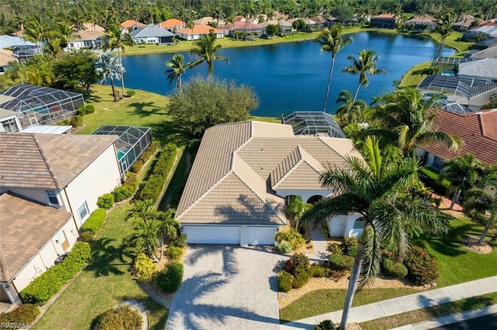 Aerial perspective of suburban area with a large body of water
