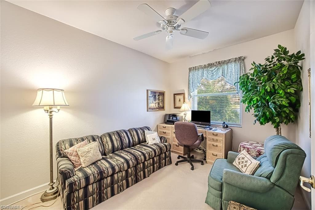Office space featuring carpet floors and ceiling fan