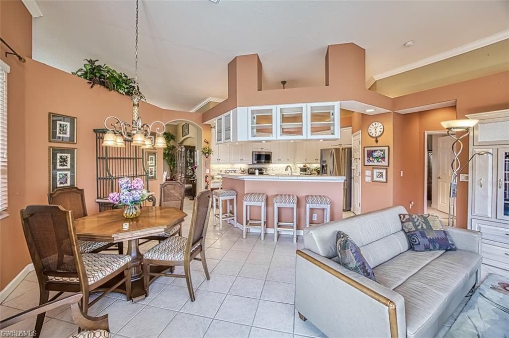 Dining space with a chandelier and light tile patterned floors