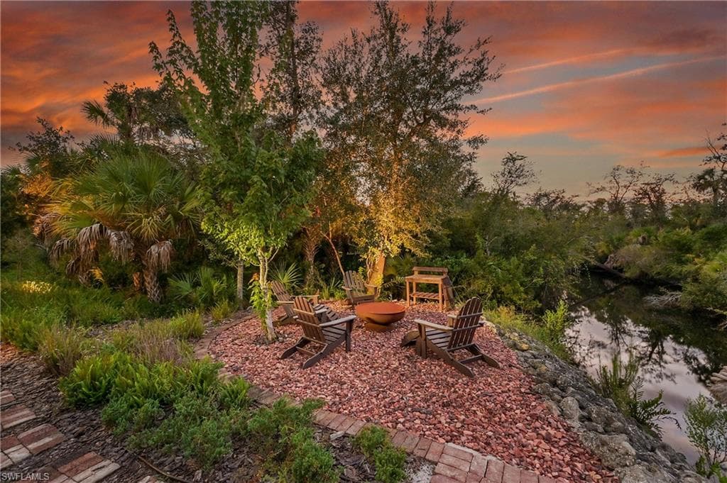 Inviting waterfront firepit area offering a perfect setting for evening gatherings to grill up some oysters