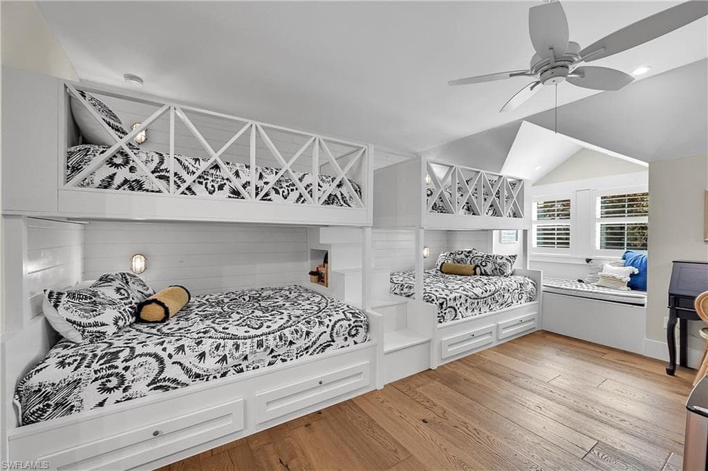 Well-designed guest quarters with custom built-in bunk full size and queen beds. Integrated storage creates a thoughtfully designed space ideal for hosting family and guests