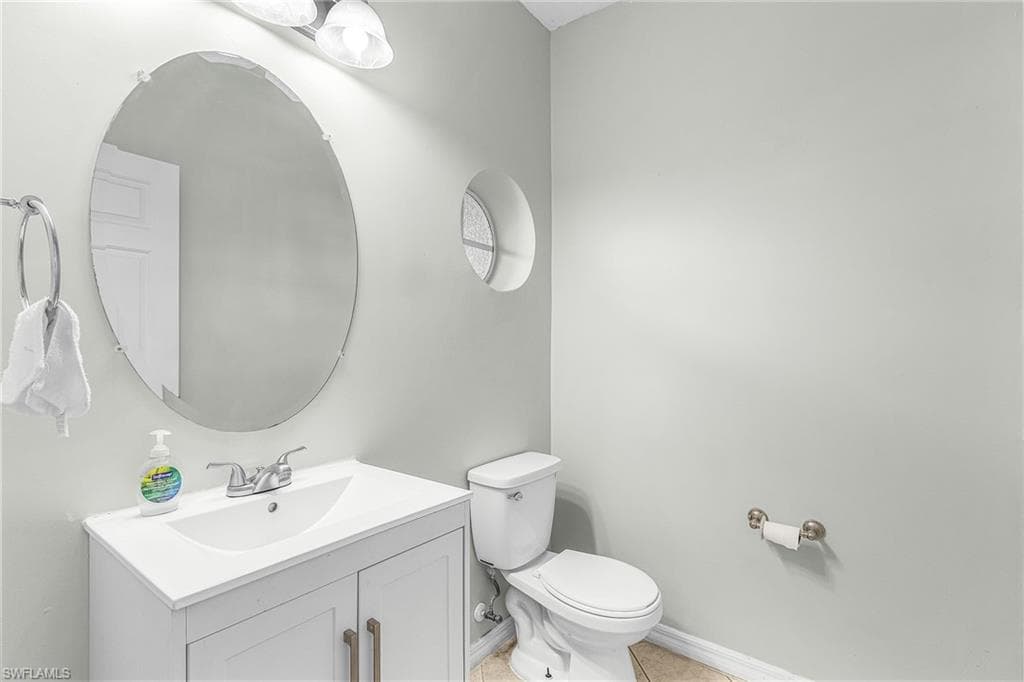 Bathroom with vanity and light tile patterned floors