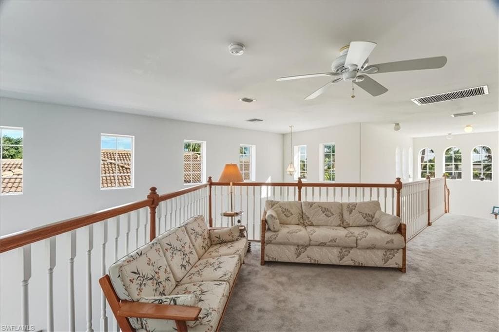 Stairway featuring a high ceiling and tile patterned floors