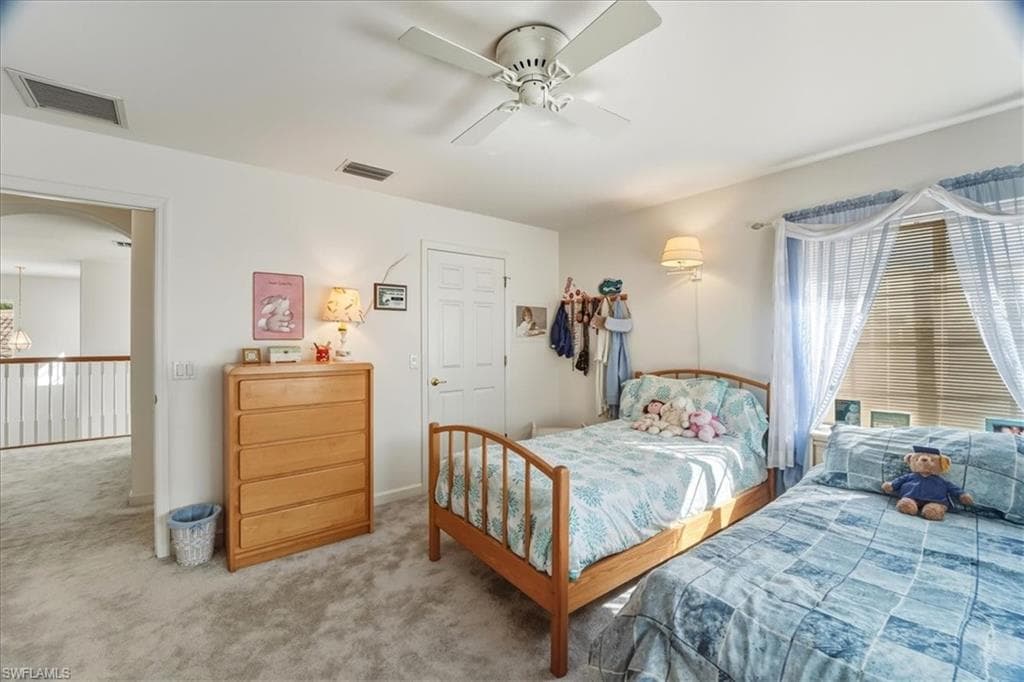 Bedroom with carpet floors and a ceiling fan