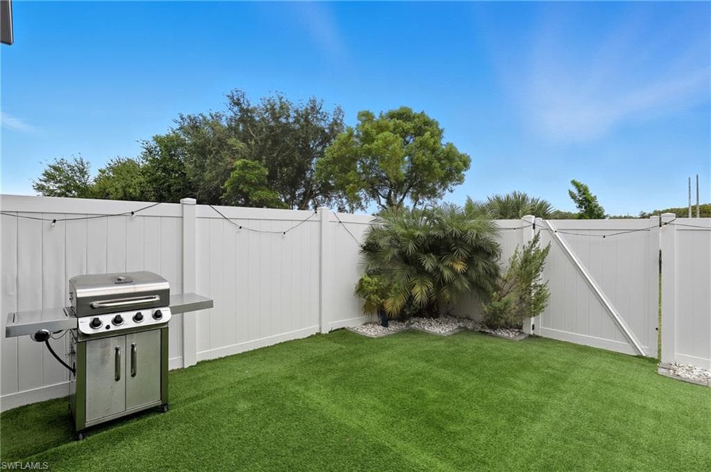 View of fenced backyard