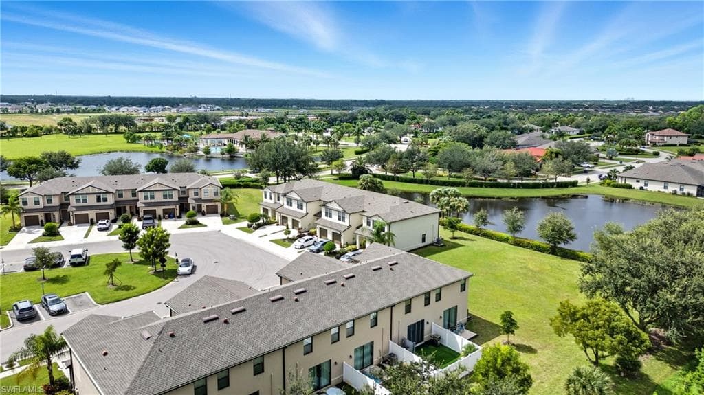 Aerial view of residential area featuring a large body of water