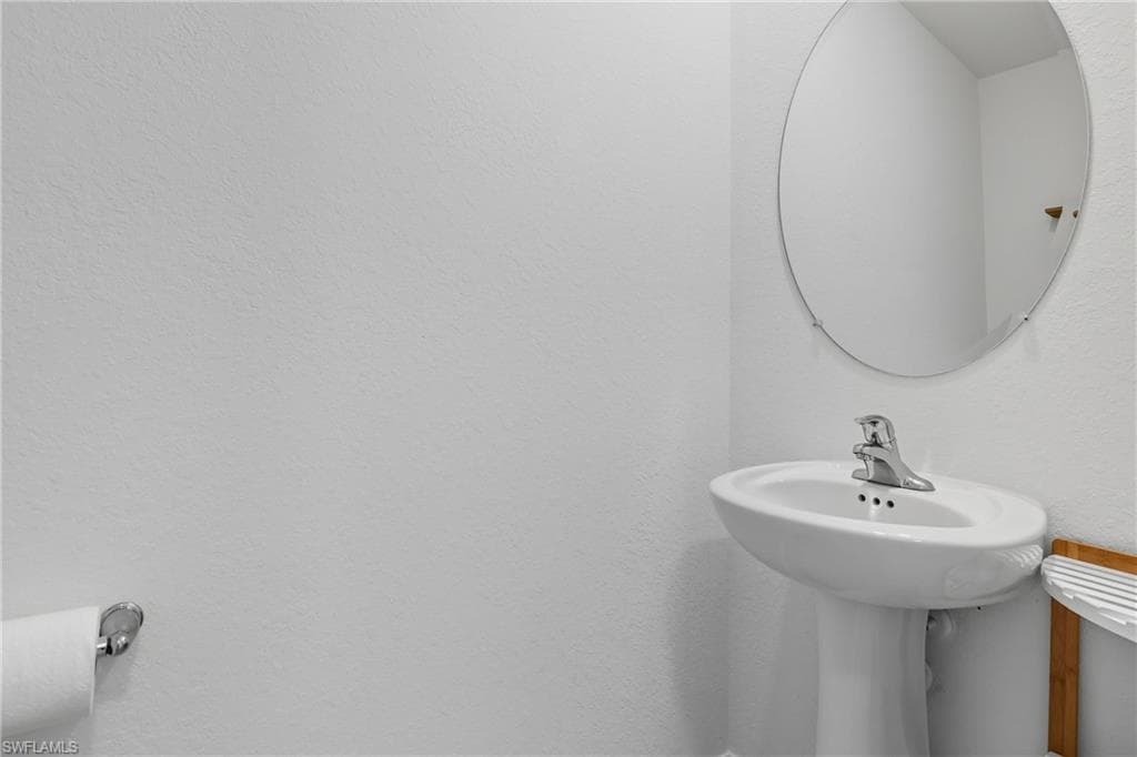 Bathroom featuring a textured wall