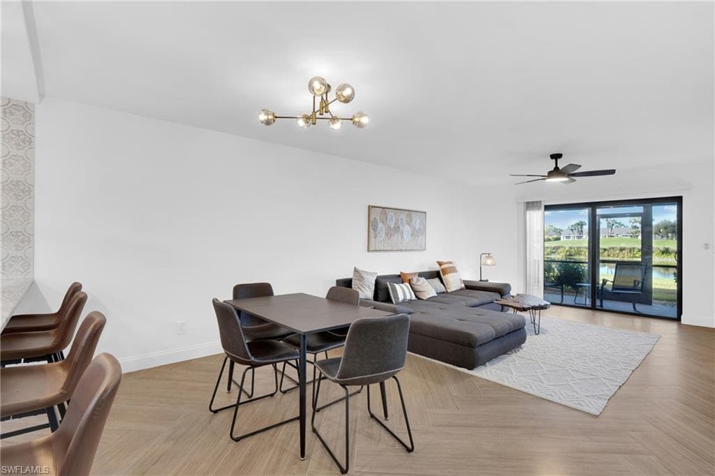 Dining area featuring a chandelier and a ceiling fan