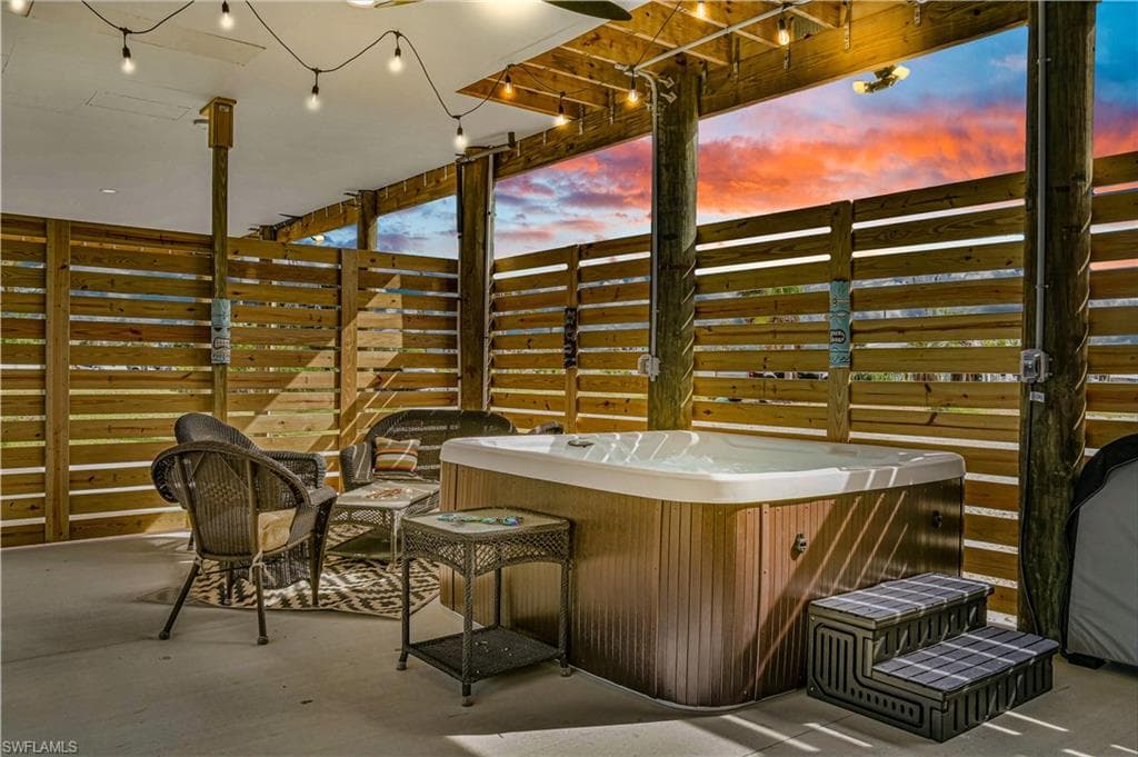 View of patio featuring a hot tub