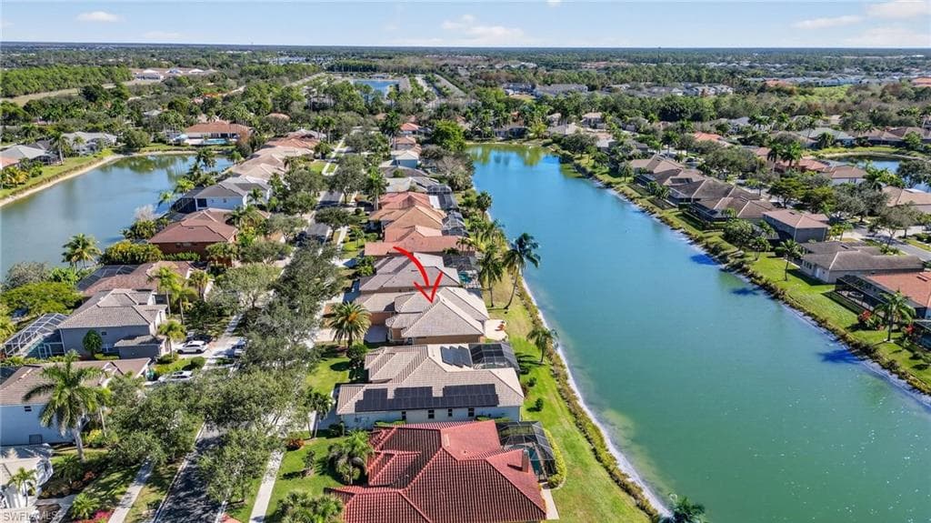 Aerial perspective of suburban area featuring a large body of water