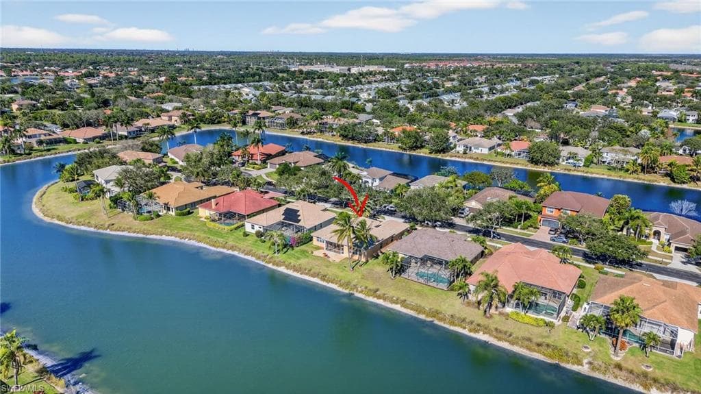 Aerial view of residential area with a nearby body of water