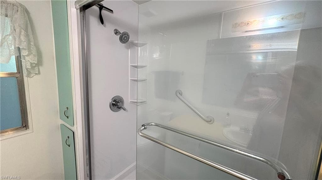Hall Bathroom also has linen storage.