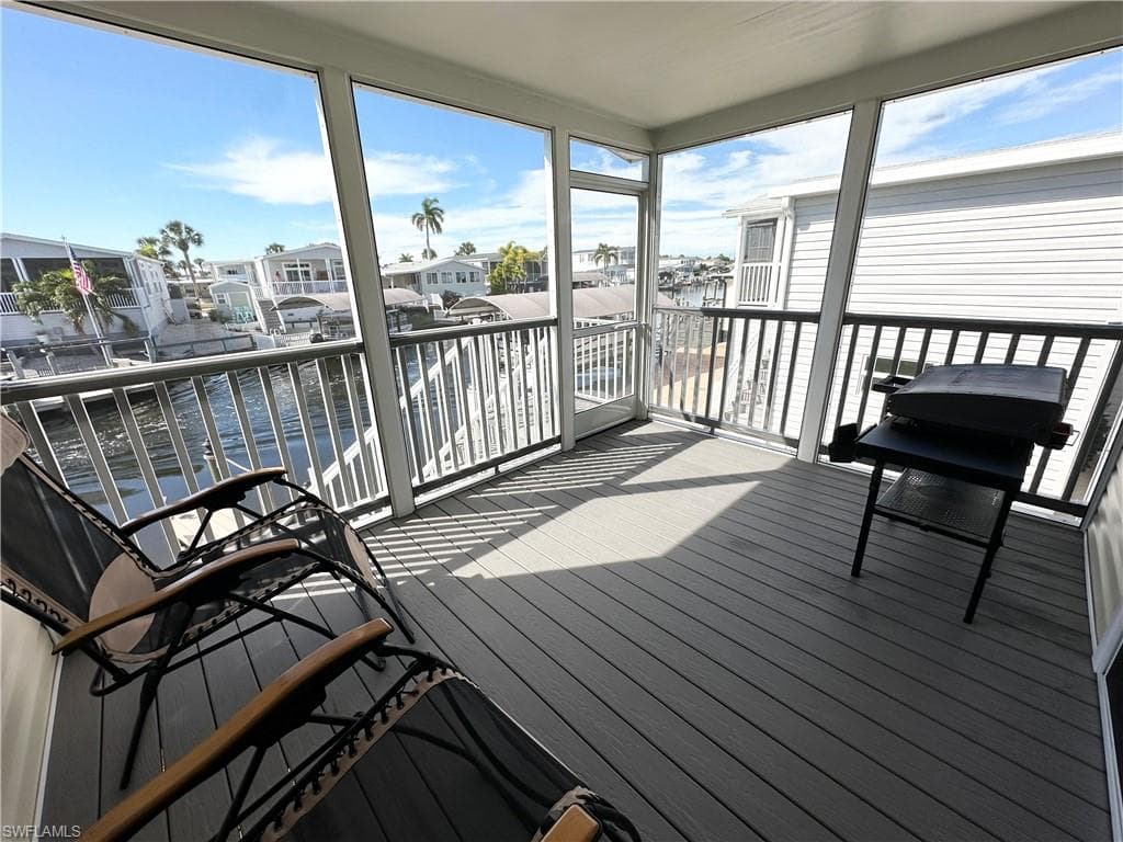 Screened-in porch overlooking the water