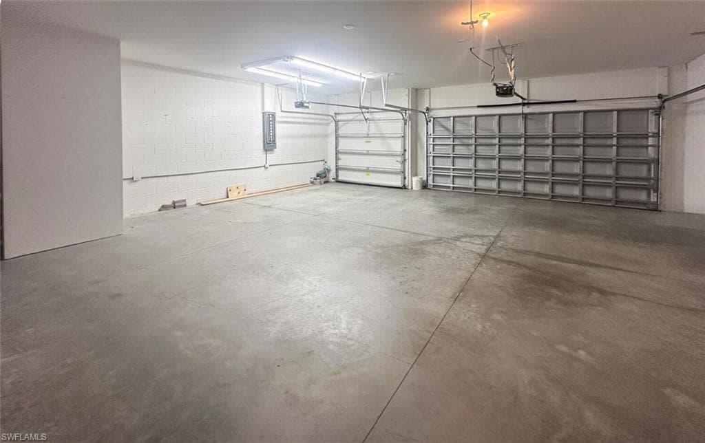Garage featuring electric panel