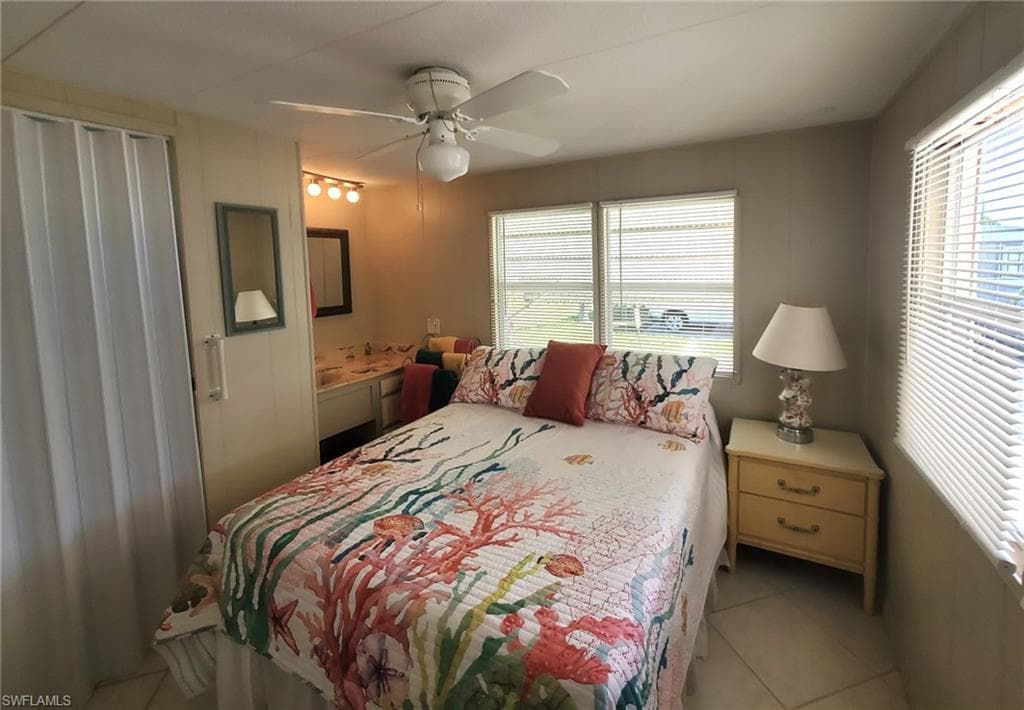 Second bedroom features in adjacent bathroom with shower.
