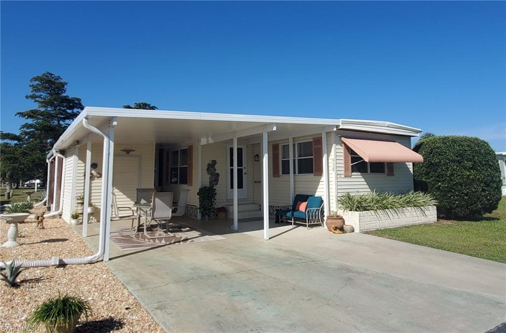 On your land and this immaculate home when you buy in Lazy Days village!