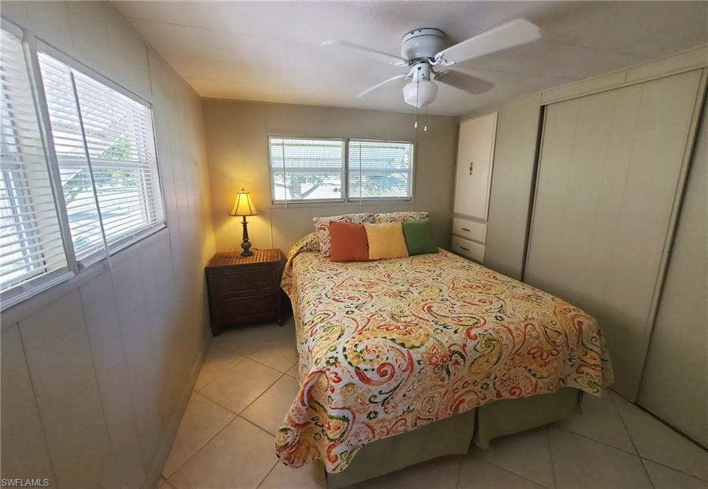 Primary bedroom features built-in cabinets and drawers and a closet.