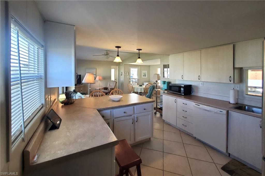 The spacious, Eat-in kitchen is fully equipped with all appliances, including a new dishwasher.