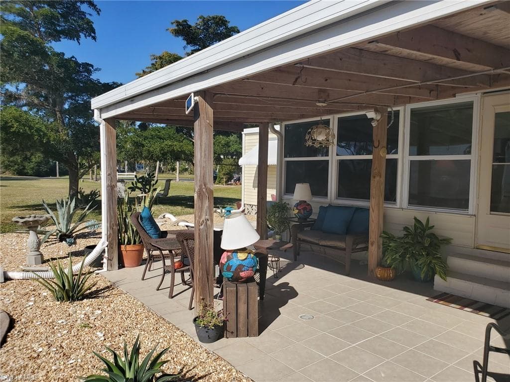 Outdoor living area with tile floor.