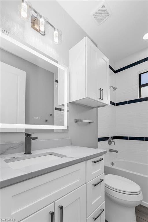 Bathroom with vanity and bathtub / shower combination