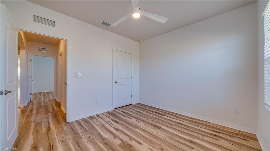 Unfurnished bedroom with light wood-style flooring and a ceiling fan