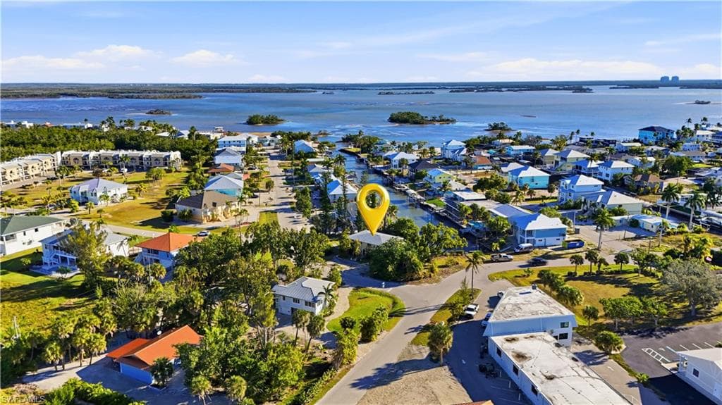 Aerial perspective of suburban area featuring a large body of water - Virtually Edited Image