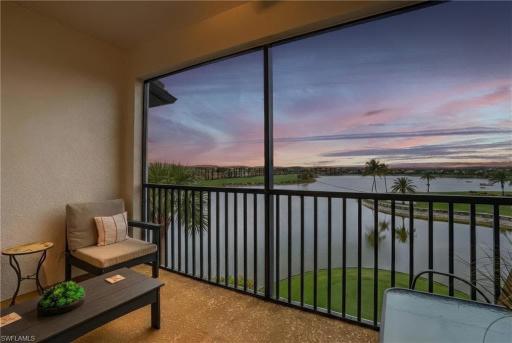 Sunroom / solarium with a water view