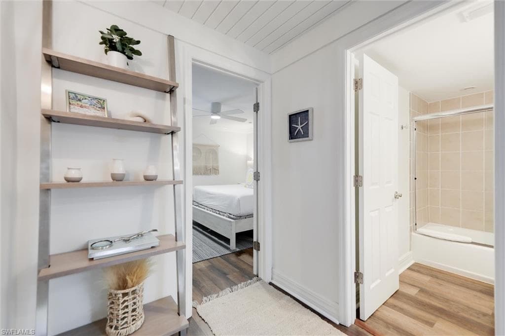 Hall featuring light wood-type flooring and wood ceiling