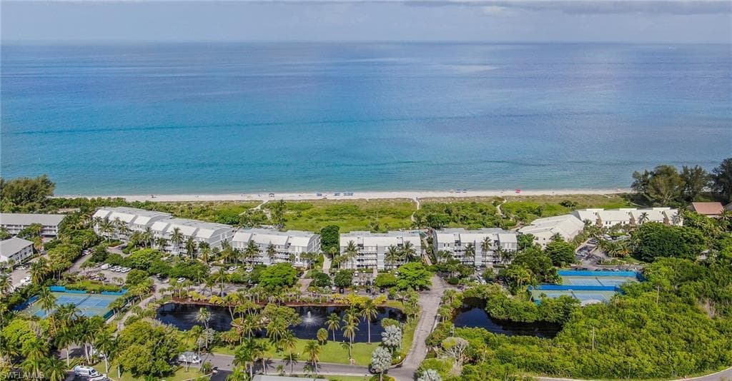Aerial view of waterfront with a beach