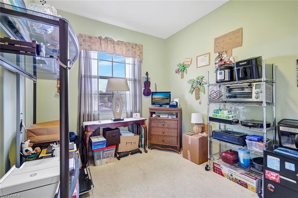 Office space featuring light colored carpet
