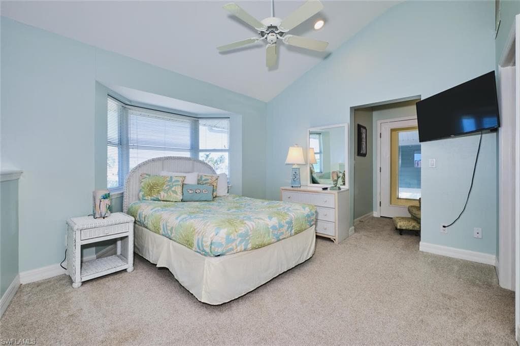 Loft Bedroom featuring light carpet, ceiling fan, high vaulted ceiling, and recessed lighting