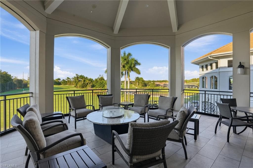 View of patio / terrace with outdoor dining space, view of golf course, and an outdoor hangout area