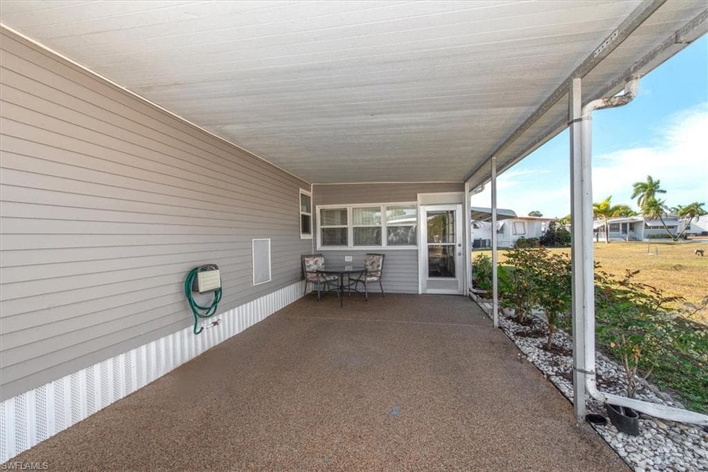View of patio / terrace with a carport