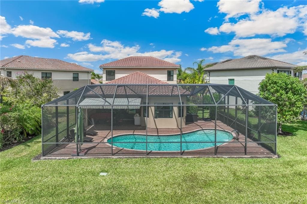Spacious 4 bedroom/4 bath pool home in Naples, Florida located on an oversize corner pie shaped lot with lake view and privacy!
