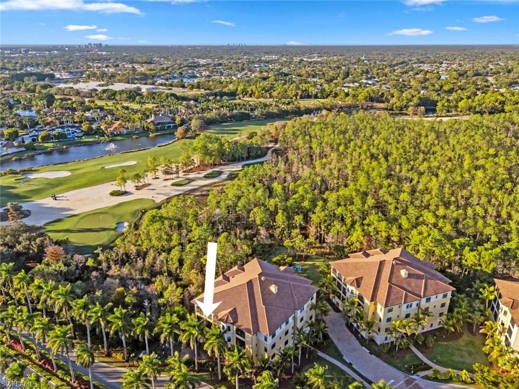 Drone / aerial view of a golf club and a nearby body of water
