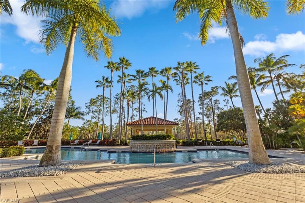 Community pool with a patio