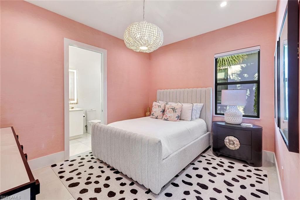 Bedroom featuring connected bathroom, light tile patterned flooring, a chandelier, and recessed lighting
