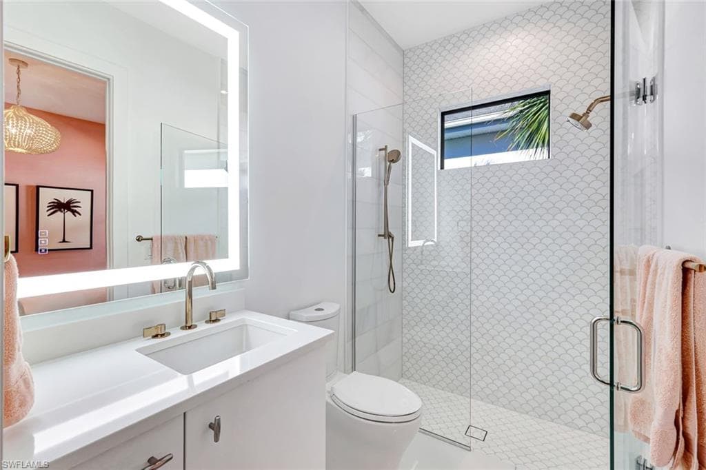 Bathroom featuring vanity and a stall shower