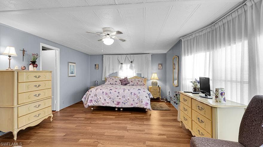 Bedroom featuring light wood-type flooring and a ceiling fan