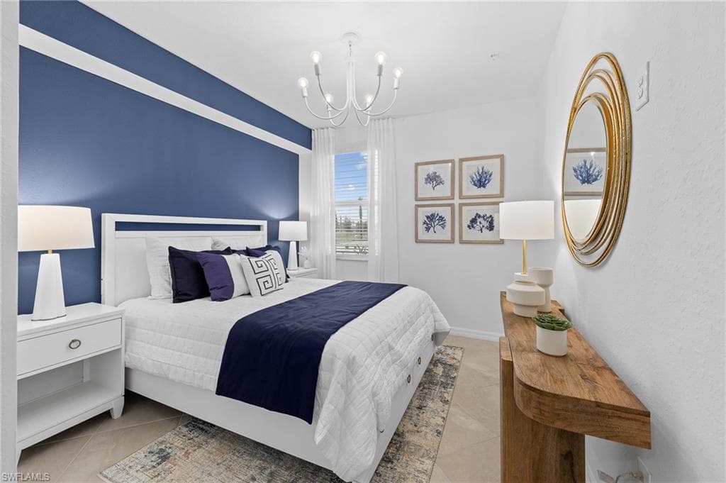 Tiled bedroom with a chandelier
