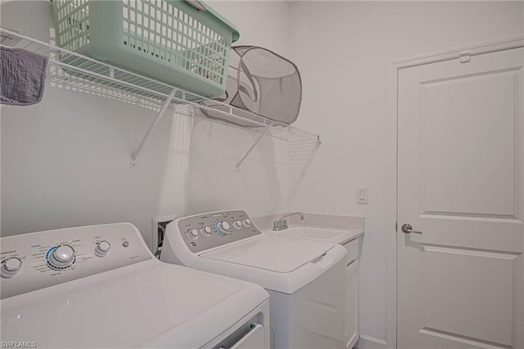 Washroom featuring separate washer and dryer
