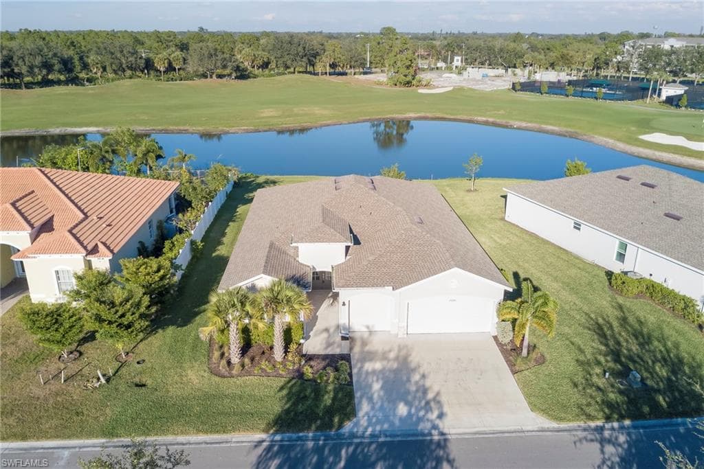 Drone / aerial view of a golf course and a large body of water