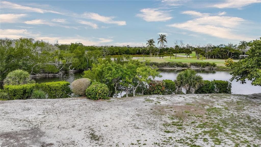 Water view featuring a tree filled landscape